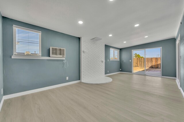 unfurnished living room featuring light hardwood / wood-style floors