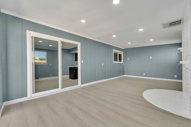 unfurnished living room with light wood-type flooring