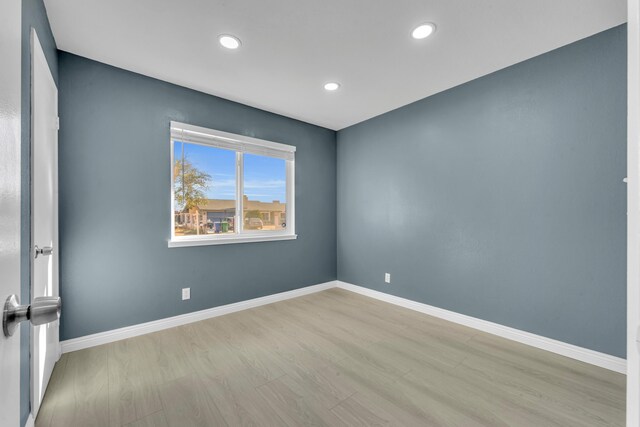 unfurnished room featuring light wood-type flooring