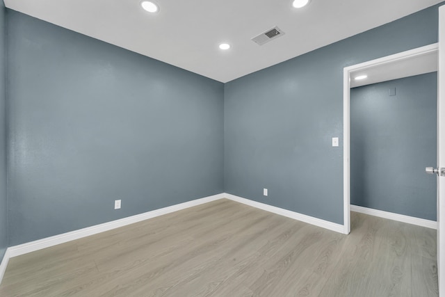 spare room featuring light hardwood / wood-style flooring