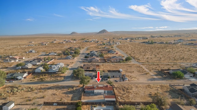 drone / aerial view featuring a mountain view