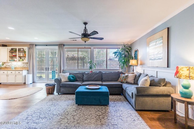 3455 Pine Mist Ct, Rosamond, CA 93560 - living area with healthy amount of natural light, a ceiling fan, french doors, ornamental molding, and wood finished floors