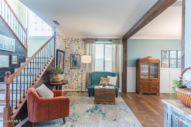 3455 Pine Mist Ct, Rosamond, CA 93560 - living area featuring stairway, wood finished floors, beamed ceiling, a wainscoted wall, and ornamental molding