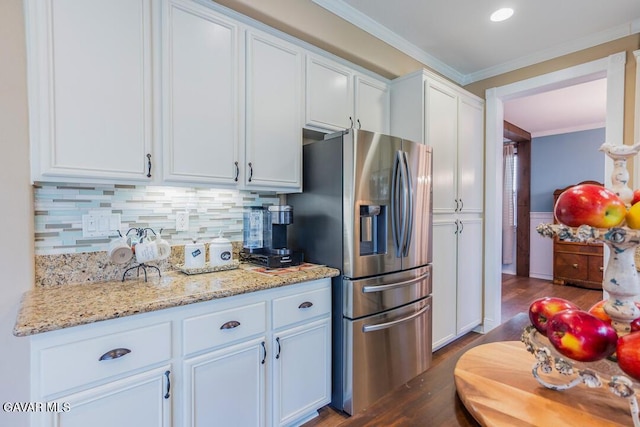 3455 Pine Mist Ct, Rosamond, CA 93560 - kitchen featuring stainless steel refrigerator with ice dispenser, dark wood finished floors, ornamental molding, white cabinetry, and tasteful backsplash