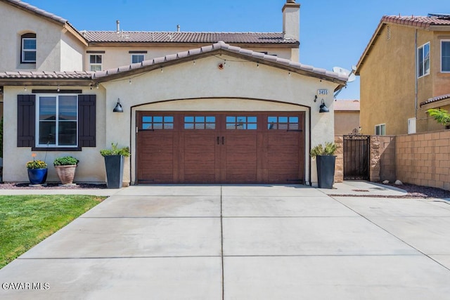 3455 Pine Mist Ct, Rosamond, CA 93560 - mediterranean / spanish-style home with a chimney, driveway, a garage, and stucco siding