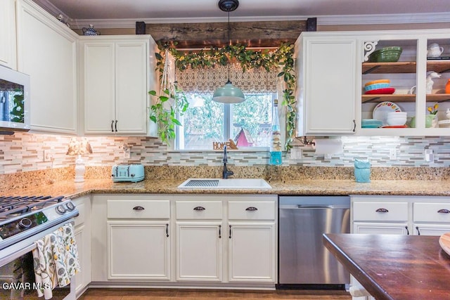 3455 Pine Mist Ct, Rosamond, CA 93560 - kitchen with appliances with stainless steel finishes, white cabinetry, tasteful backsplash, open shelves, and decorative light fixtures