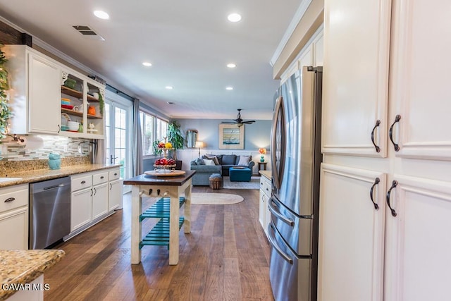 3455 Pine Mist Ct, Rosamond, CA 93560 - kitchen with appliances with stainless steel finishes, white cabinetry, recessed lighting, backsplash, and a ceiling fan