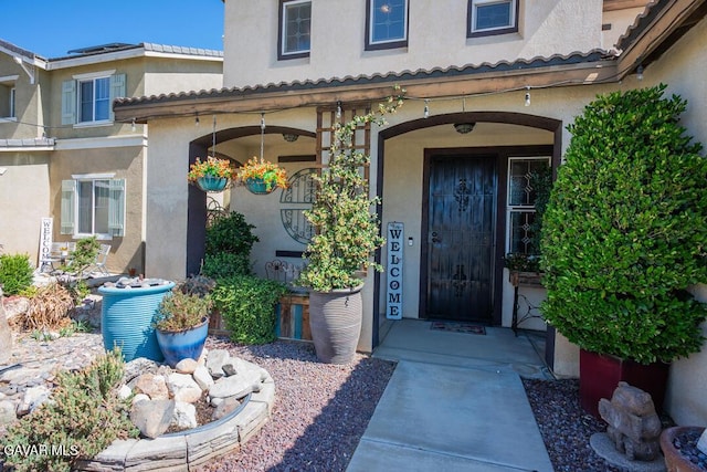 3455 Pine Mist Ct, Rosamond, CA 93560 - property entrance with stucco siding and covered porch