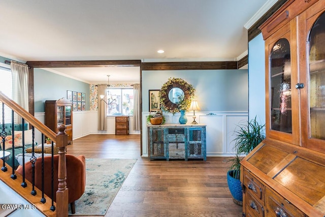 3455 Pine Mist Ct, Rosamond, CA 93560 - entryway with a decorative wall, ornamental molding, a wainscoted wall, wood finished floors, and stairs