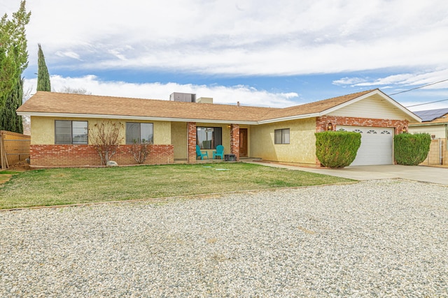 ranch-style house with a front yard and a garage