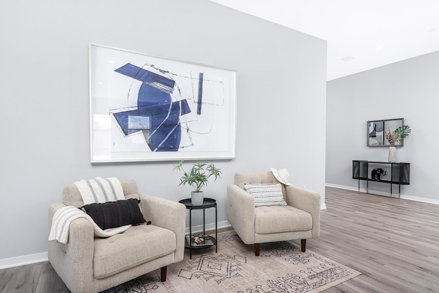 sitting room featuring hardwood / wood-style floors