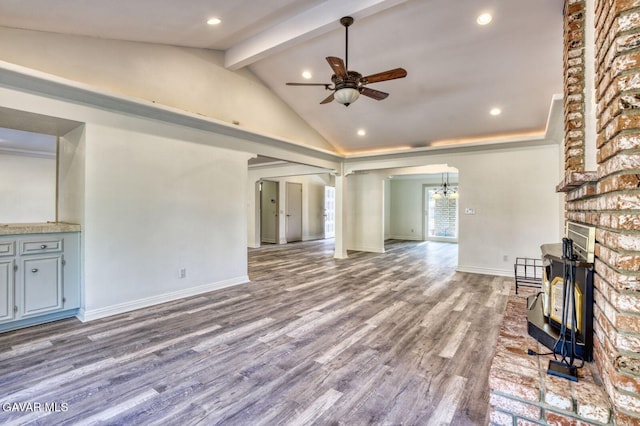 43737 W 27th St, Lancaster, CA 93536 - unfurnished living room featuring a ceiling fan, beam ceiling, wood finished floors, recessed lighting, and a fireplace