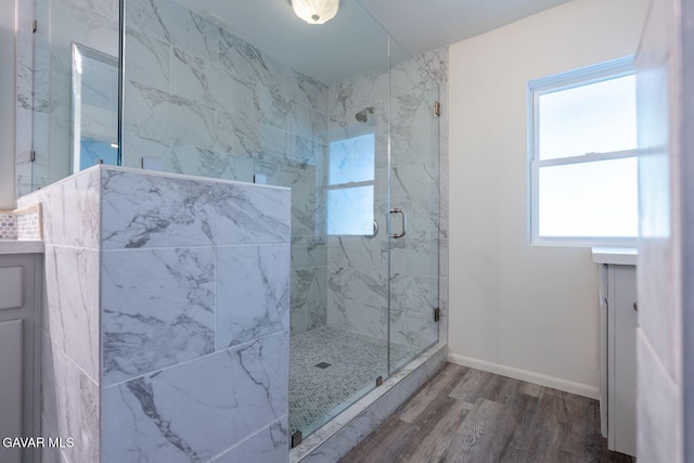 43737 W 27th St, Lancaster, CA 93536 - bathroom featuring a marble finish shower, wood finished floors, plenty of natural light, and vanity