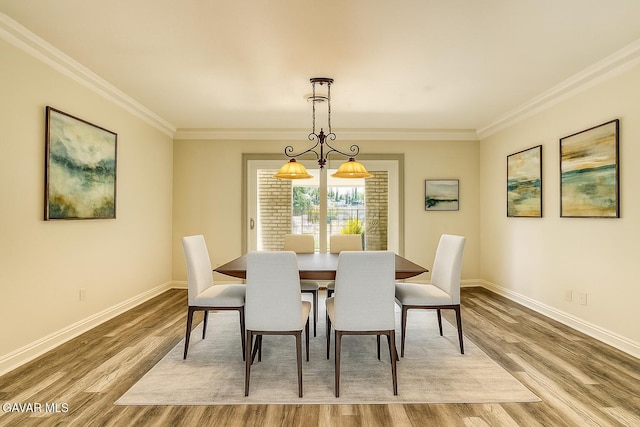 43737 W 27th St, Lancaster, CA 93536 - dining area featuring wood finished floors and ornamental molding