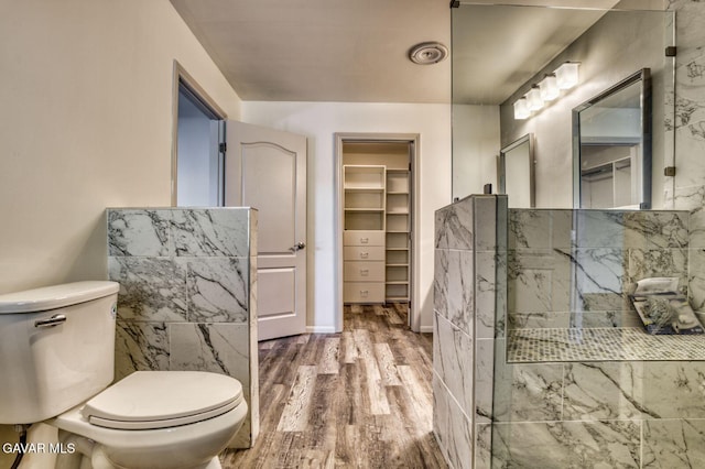 43737 W 27th St, Lancaster, CA 93536 - full bathroom with wood finished floors, a spacious closet, and a shower