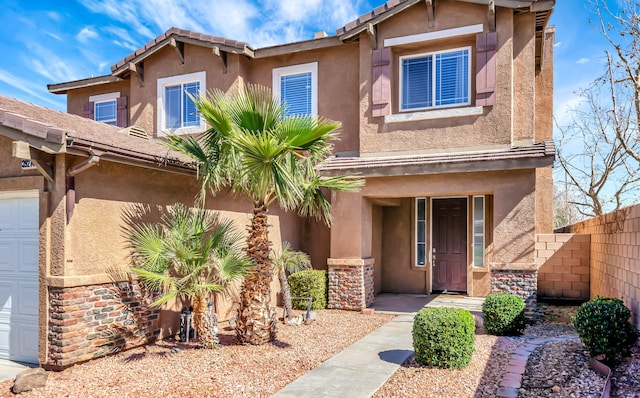 view of front of home with fence and stucco siding