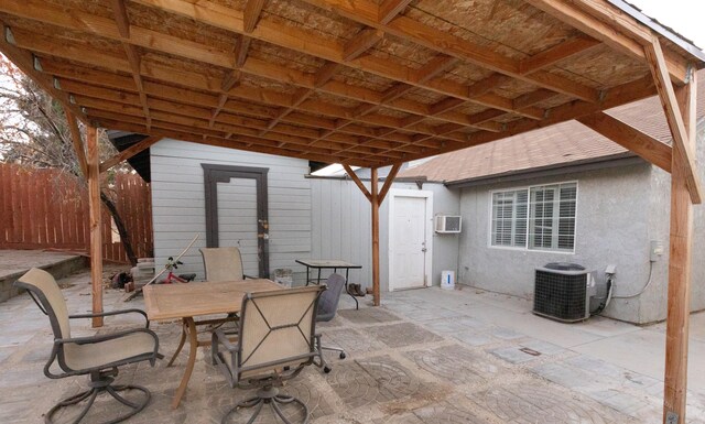 view of patio / terrace featuring central AC and a wall mounted AC
