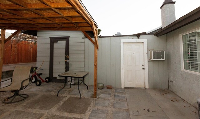 view of patio featuring a wall mounted AC