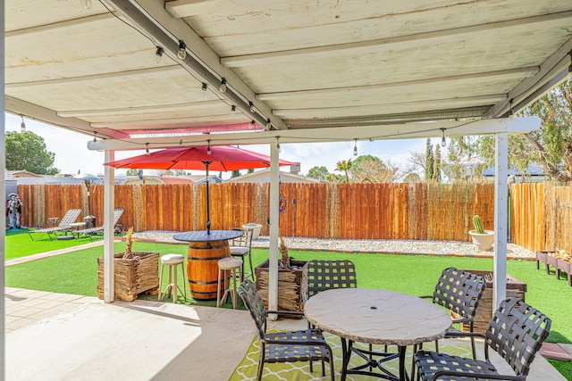 view of patio / terrace with outdoor dining area and a fenced backyard