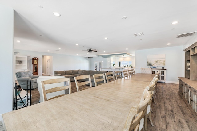 dining room with recessed lighting, wood finished floors, ceiling fan, and baseboards