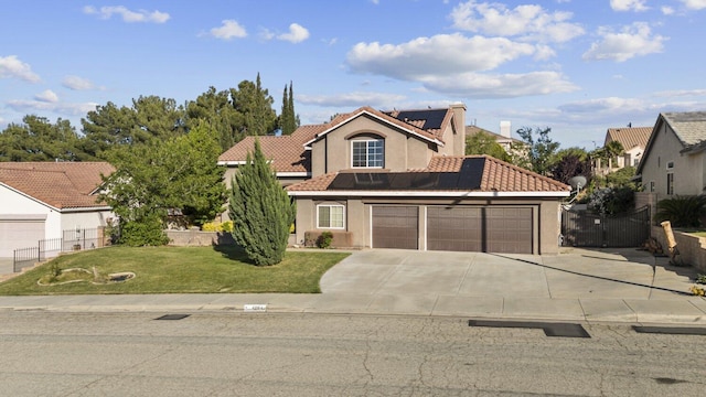42164 Valley Vista Dr, Lancaster, CA 93536 - view of front facade featuring solar panels, stucco siding, an attached garage, concrete driveway, and a tile roof