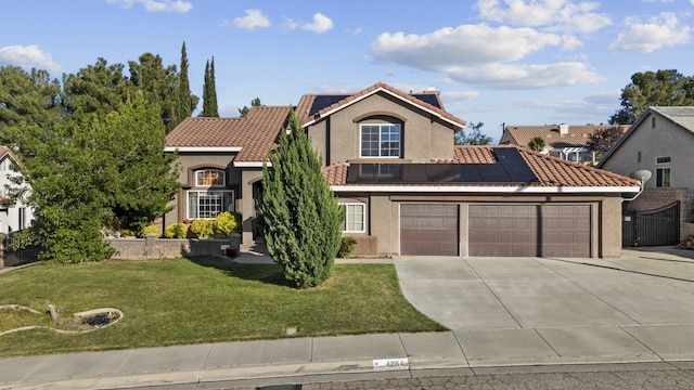 42164 Valley Vista Dr, Lancaster, CA 93536 - view of front of house featuring driveway, solar panels, a garage, stucco siding, and a front yard