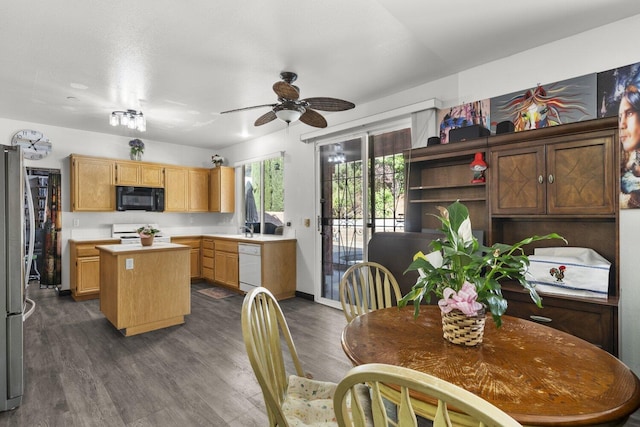 42164 Valley Vista Dr, Lancaster, CA 93536 - kitchen with black microwave, gas range, a center island, dishwasher, and light countertops