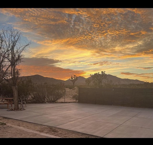 patio terrace at dusk with a mountain view