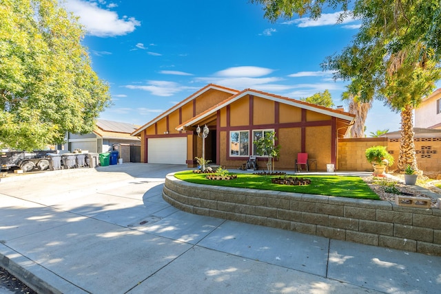 view of front of house featuring a garage and a front yard