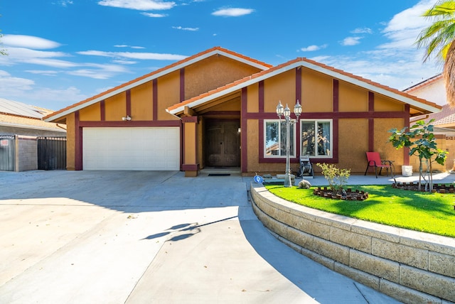 view of front of house with a front yard and a garage