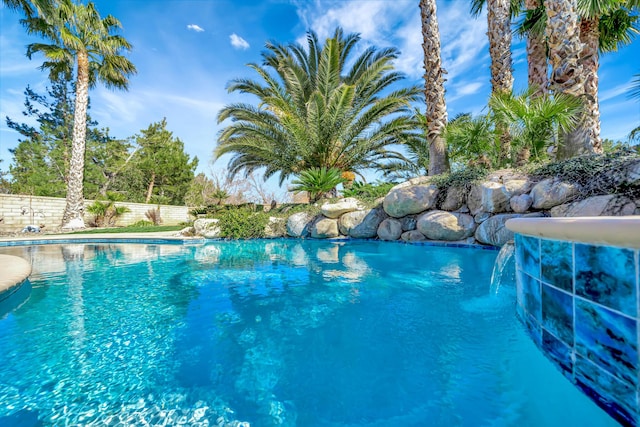 view of pool with fence and a fenced in pool