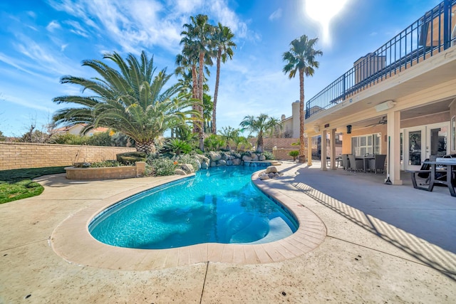 view of pool with a fenced in pool, a patio, a ceiling fan, outdoor dining space, and fence