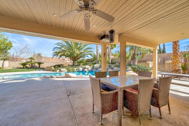 view of patio with a fenced in pool, a fenced backyard, and ceiling fan