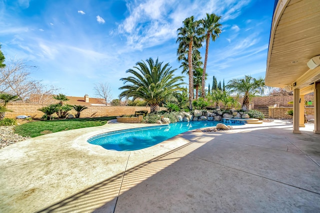 view of pool featuring a fenced in pool, a patio area, and a fenced backyard