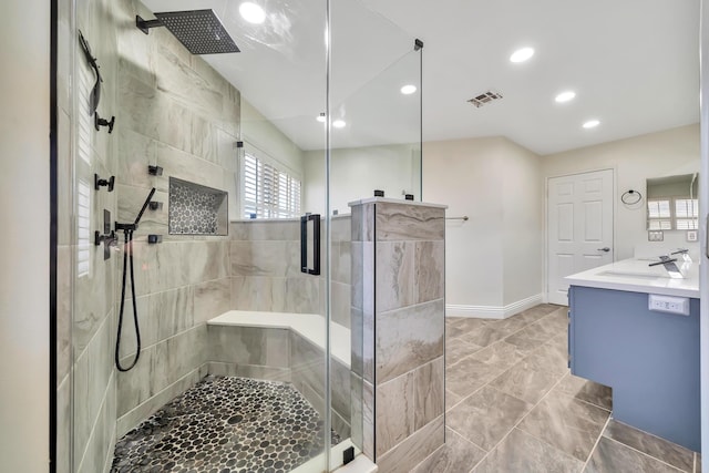 full bathroom with recessed lighting, visible vents, baseboards, vanity, and a stall shower