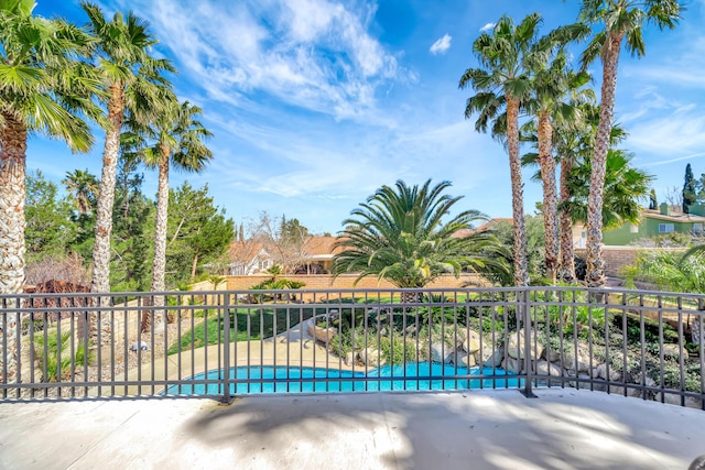 view of pool featuring a patio, fence, and a fenced in pool