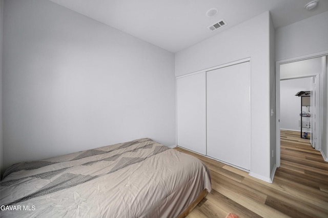3432 Andrew Ave, Rosamond, CA 93560 - bedroom featuring wood finished floors and a closet