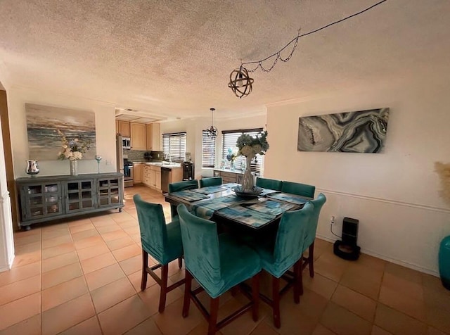 tiled dining room with a textured ceiling