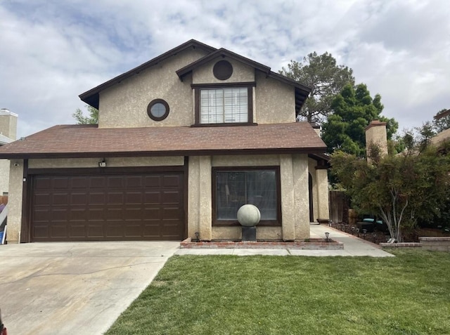 view of front property with a garage and a front yard