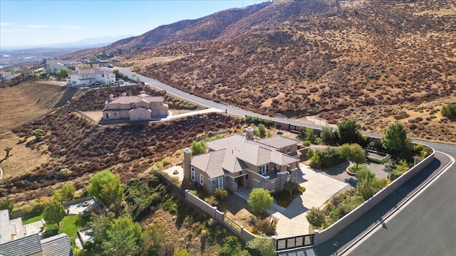 birds eye view of property with a mountain view