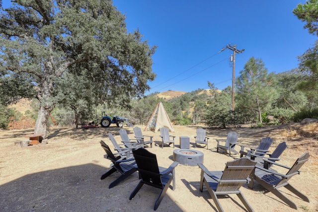 view of patio / terrace with an outdoor fire pit