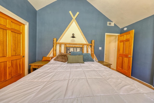 bedroom featuring lofted ceiling