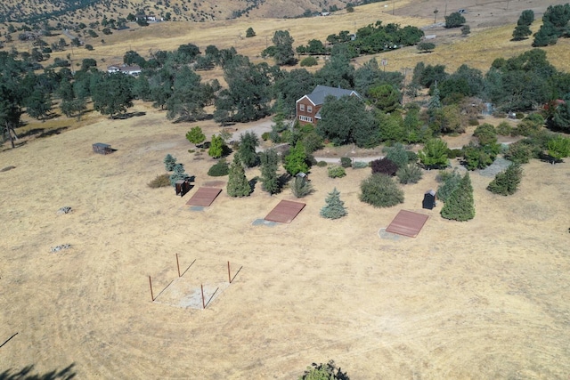 birds eye view of property with a rural view