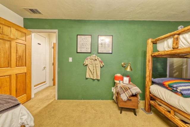 bedroom featuring light colored carpet