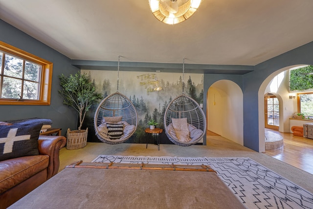 living room with light colored carpet and a wealth of natural light