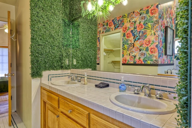 bathroom featuring decorative backsplash, vanity, tile patterned floors, and ceiling fan