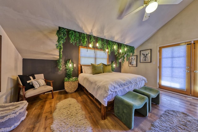 bedroom featuring ceiling fan, wood-type flooring, and lofted ceiling