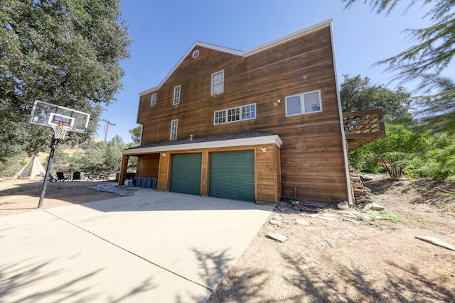 view of side of home featuring a garage