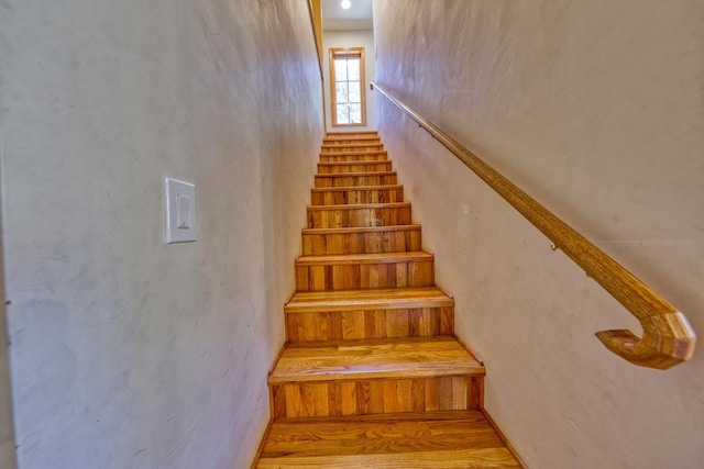 stairs with hardwood / wood-style flooring