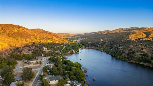 aerial view featuring a water and mountain view